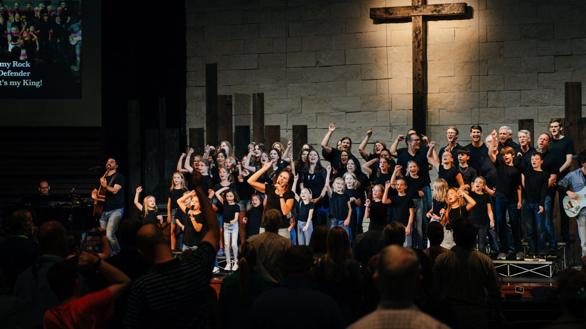 Worship Arts volunteers singing together.